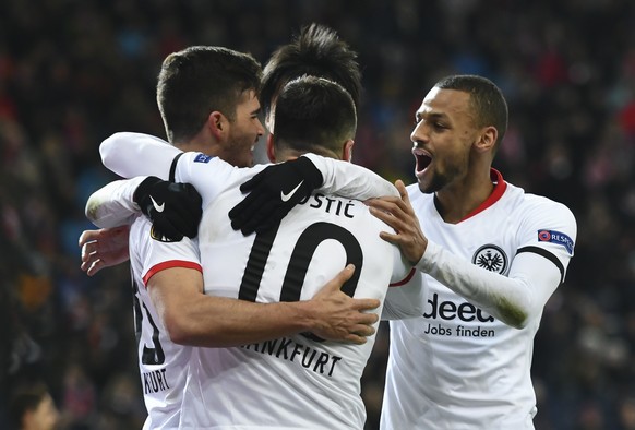 epa08256614 Frankfurt&#039;s Andre Silva (L) joined by Filip Kostic (C) and Djibril Sow (R) celebrates after he scores a goal during the UEFA Europa League Round of 32, 2nd leg match between Red Bull  ...