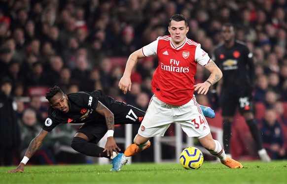 epa08098288 Arsenal&#039;s Granit Xhaka (R) in action against Manchester United&#039;s Fred (L) during the English Premier league soccer match between Arsenal and Manchester United held at the Emirate ...