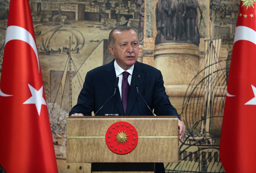 epa08616376 A handout photo made available by the Turkish President Press Office shows Turkish President Recep Tayyip Erdogan speaks during a press conference as he announces the biggest natural gas d ...