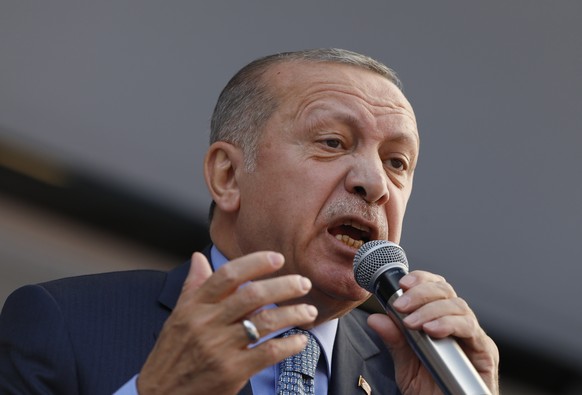 Turkey&#039;s President Recep Tayyip Erdogan addresses the supporters of his ruling Justice and Development Party, AKP, during a rally in Ankara, Turkey, Thursday, March 14, 2019. Continuing an exchan ...