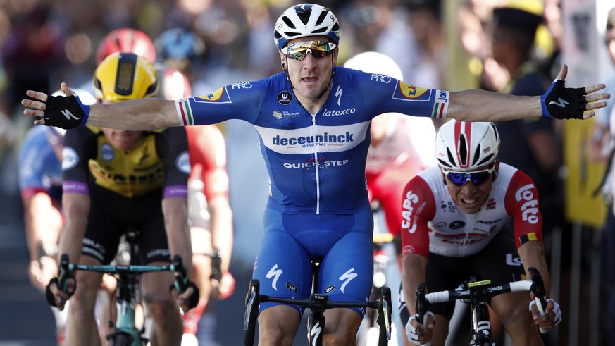 epa07705761 Italy&#039;s Elia Viviani of Deceuninck Quick Step team celebrates his win as he crosses the finish line of 4th stage of the 106th edition of the Tour de France cycling race over 213,5km b ...
