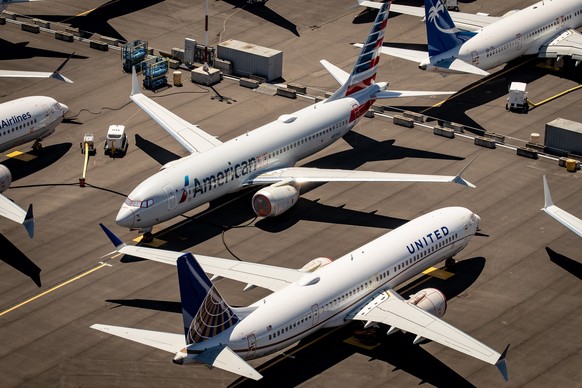 epa08175497 (FILE) - An aerial view of Boeing 737 Max 8 aircraft owned by American Airlines and United Airlines parked at Boeing Field in Seattle, Washington, USA, 21 July 2019 (reissued 29 January 20 ...