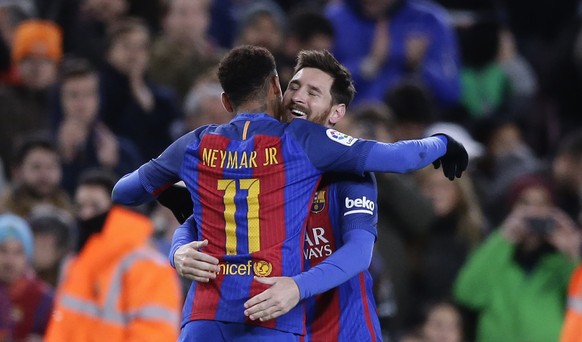 FC Barcelona&#039;s Lionel Messi, right, celebrates after scoring with his teammate Neymar during a Copa del Rey, 16 round, second leg, between FC Barcelona and Athletic Bilbao at the Camp Nou in Barc ...