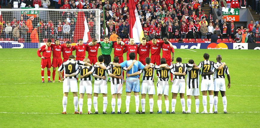 LIVERPOOL, ENGLAND - TUESDAY APRIL 5th 2005: Liverpool and Juventus players stand for a minute&#039;s silence to remember the 39 victims of the Heysel Stadium disaster in 1985 before the UEFA Champion ...