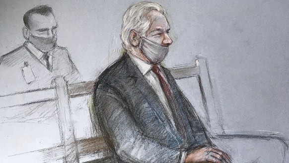 This is a court artist sketch by Elizabeth Cook of Julian Assange appearing at the Old Bailey in London for the ruling in his extradition case, in London, Monday, Jan. 4, 2021. A British judge has rej ...