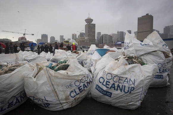 Oversized bags of plastic trash recovered by Netherlands-based group The Ocean Cleanup are displayed during a stop at port in Vancouver, on Thursday December 12, 2019. The Dutch non-profit organizatio ...
