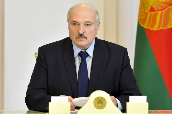 Belarusian President Alexander Lukashenko attends a meeting on issues of functioning and increasing the efficiency of the construction industry in Minsk, Belarus, Friday, Aug. 14, 2020. In five days o ...