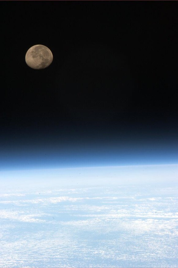 In this image provided by NASA shows moonset over earth as seen from the International Space Station, Tuesday May 7, 2013. Moonsets can be seen 16 times a day from the International Space Station. (AP ...