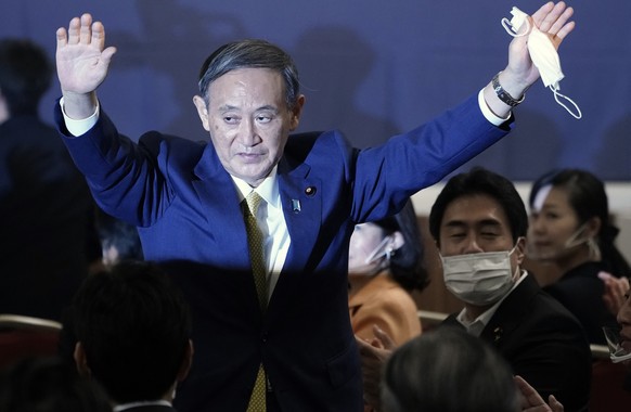 Japanese Chief Cabinet Secretary Yoshihide Suga acknowledges as he is elected as new head of Japan&#039;s ruling party at the Liberal Democratic Party&#039;s (LDP) leadership election Monday, Sept. 14 ...