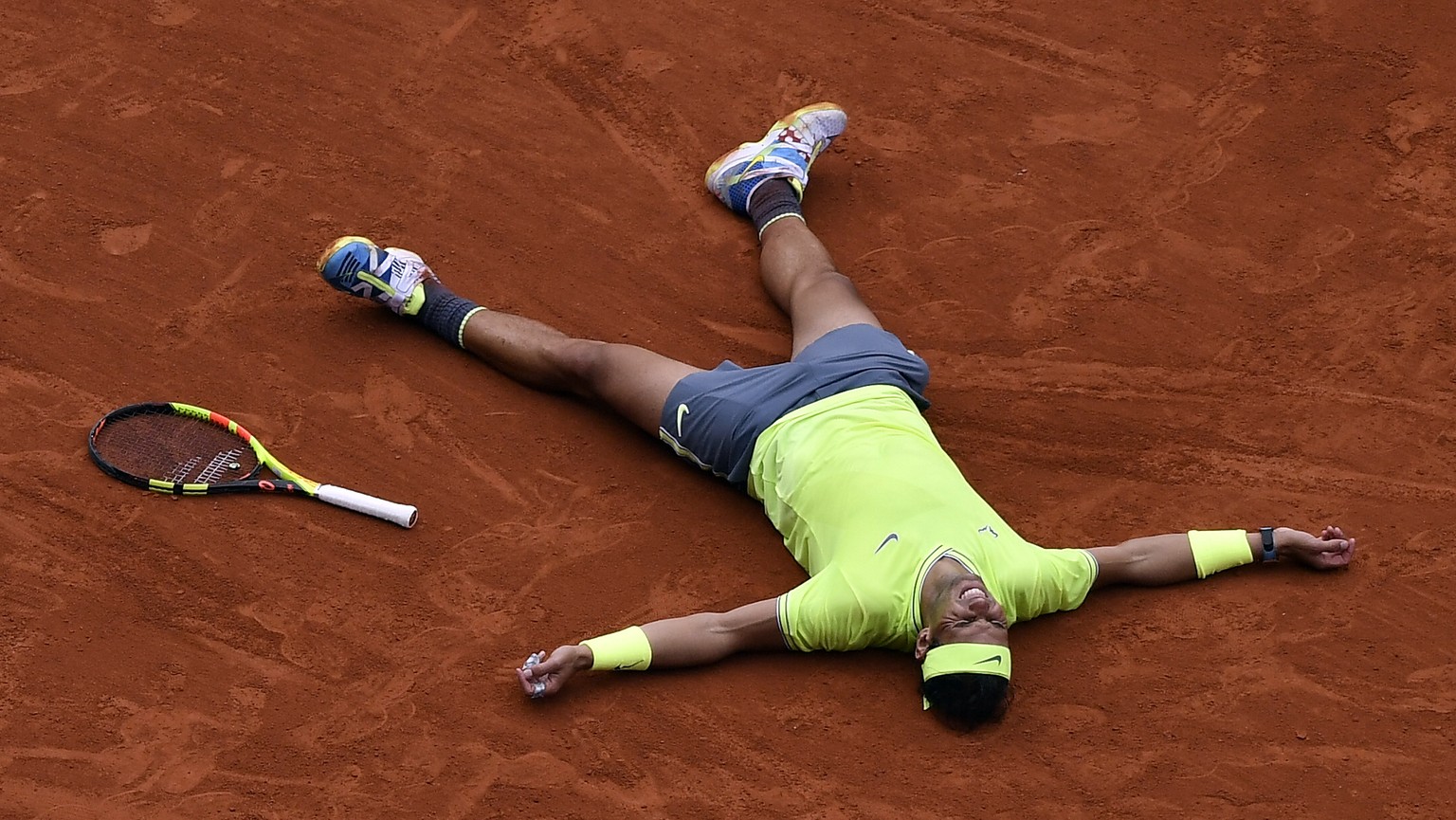 epaselect epa07637281 Rafael Nadal of Spain reacts after winning the men’s final match against Dominic Thiem of Austria during the French Open tennis tournament at Roland Garros in Paris, France, 09 J ...