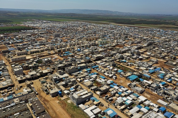 This April 19, 2020 photo shows a large refugee camp on the Syrian side of the border with Turkey, near the town of Atma, in Idlib province, Syria. The rapid spread of the coronavirus has raised fears ...