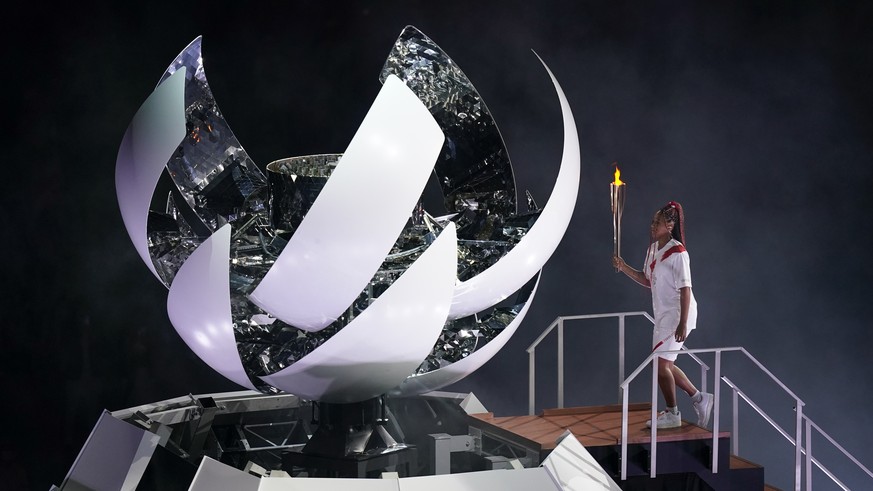 Japan&#039;s Naomi Osaka prepares to light the cauldron during the opening ceremony in the Olympic Stadium at the 2020 Summer Olympics, Friday, July 23, 2021, in Tokyo, Japan. (AP Photo/Patrick Semans ...
