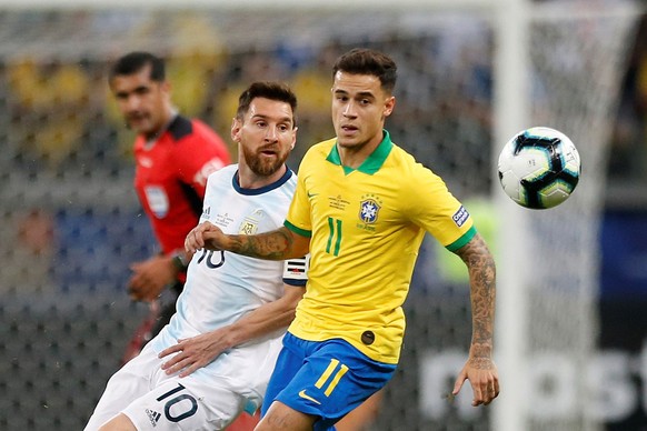 epa07690821 Philippe Coutinho (R) of Brazil in action against Lionel Messi (L) of Argentina during the Copa America 2019 semi-finals soccer match between Brazil and Argentina, at Mineirao Stadium in B ...