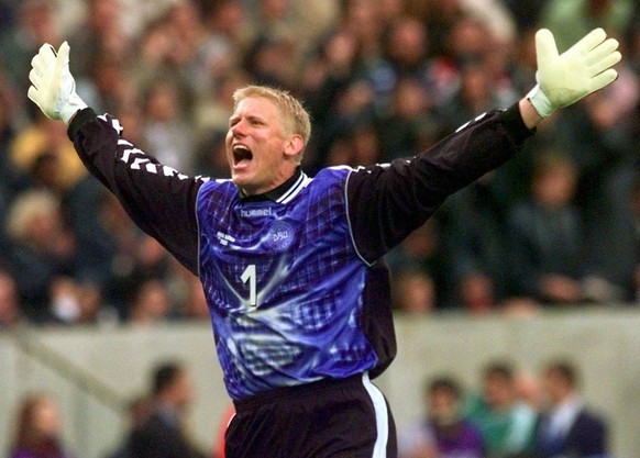 Danish goalkeeper Peter Schmeichel celebrates his teams 1-0 win over Saudi Arabia in the group C match at the 1998 soccer World Cup between Saudi Arabia and Denmark at the Felix Bollaert Stadium in Le ...
