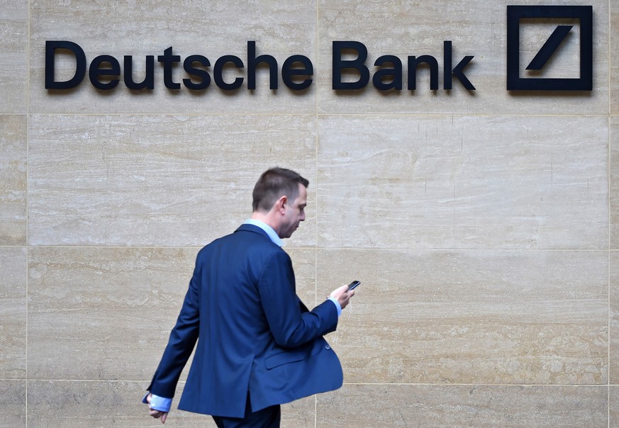 epa07701620 (FILE) - A man walks past by the British headquarters of the German Deutsche Bank in London, Britain, 30 September 2016 (reissued 07 July 2019). According to reports 07 July 2019, German b ...