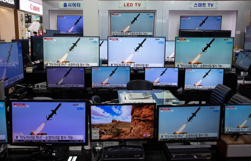 epa09092585 TV screens show news broadcast at the Yongsan electronics market in Seoul, South Korea, 24 March 2021. US President Joe Biden&#039;s administration officials on 23 March reportedly confirm ...