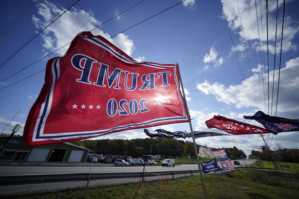 Trump campaign banners wave in the wind along Route 8 in Middlesex Township, Pa., in conservative Butler County on Thursday, Oct. 15, 2020. To win Pennsylvania, President Donald Trump needs blowout vi ...