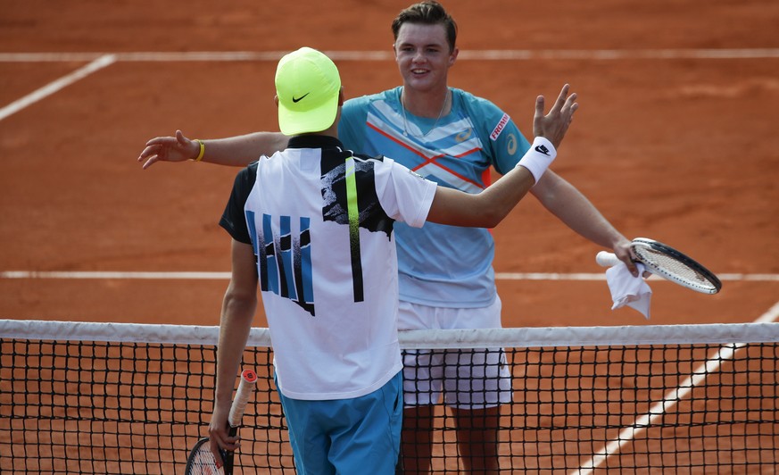 Switzerland&#039;s Dominic Stephan Stricker, right, is congratulated by Switzerland&#039;s Leandro Riedi after Stricker won the junior men&#039;s final match of the French Open tennis tournament at th ...