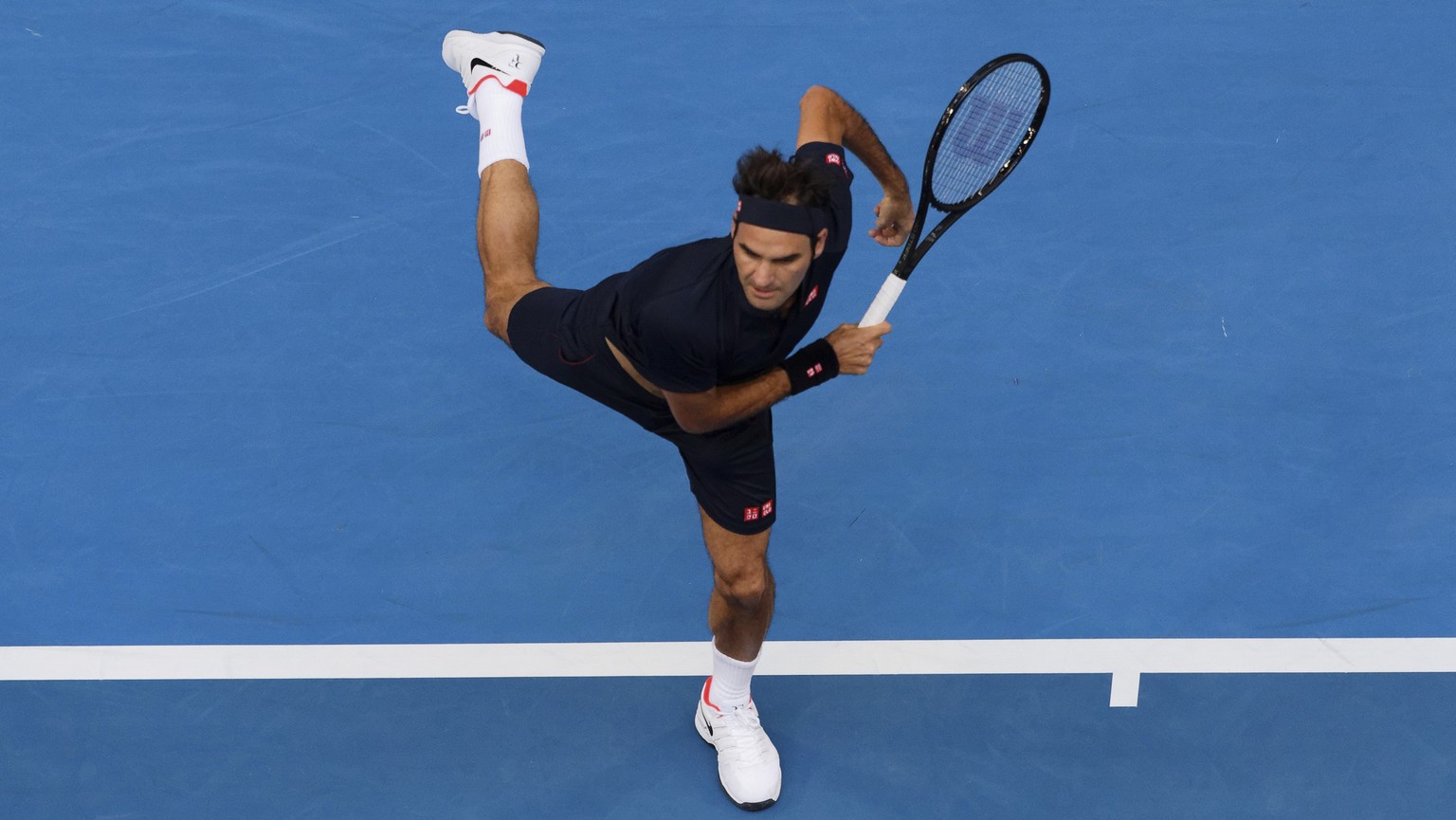 Switzerland&#039;s Roger Federer plays a shot during his match against at Frances Tiafoe of the United States at the Hopman Cup in Perth, Australia, Tuesday, Jan. 1, 2019. (AP Photo/Trevor Collens)