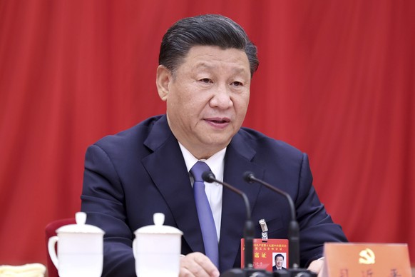 In this photo released by Xinhua News Agency, Chinese President Xi Jinping, also general secretary of the Communist Party of China (CPC) Central Committee, speaks during fifth plenary session of the 1 ...