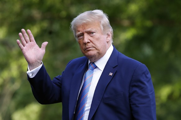 President Donald Trump walks on the South Lawn of the White House in Washington, Sunday, June 14, 2020, after stepping off Marine One as he returns from his golf club in New Jersey. (AP Photo/Patrick  ...
