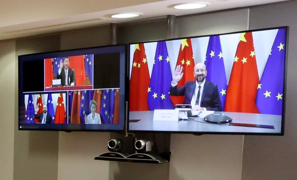 epa08501898 European Council President Charles Michel (R) and European Commission President Ursula von der Leyen (L) take part in a virtual summit with Chinese President Xi Jinping in Brussels, Belgiu ...