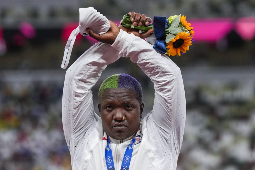 Raven Saunders, of the United States, poses with her silver medal on women&#039;s shot put at the 2020 Summer Olympics, Sunday, Aug. 1, 2021, in Tokyo, Japan. During the photo op at her medals ceremon ...