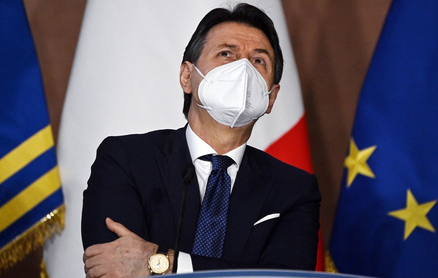 epa08911296 Italian premier Giuseppe Conte reacts during the year-end press conference organized by the Order of Journalists (ODG) at Villa Madama, Rome, Italy, 30 December 2020. EPA/Riccardo Antimian ...