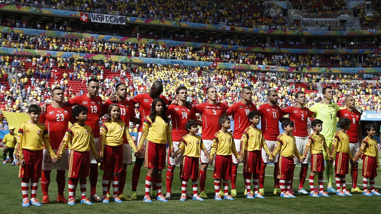 Switzerland&#039;s players listen to the national anthem prior to the group E preliminary round match between Switzerland and Ecuador in the National Stadium in Brasilia, Brazil, Sunday, June 15, 2014 ...