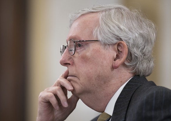 FILE - In this March 24, 2021, file photo Senate Minority Leader Mitch McConnell, R-Ky., listens as the Senate Rules Committee holds a hearing on the &quot;For the People Act,&quot; which would expand ...