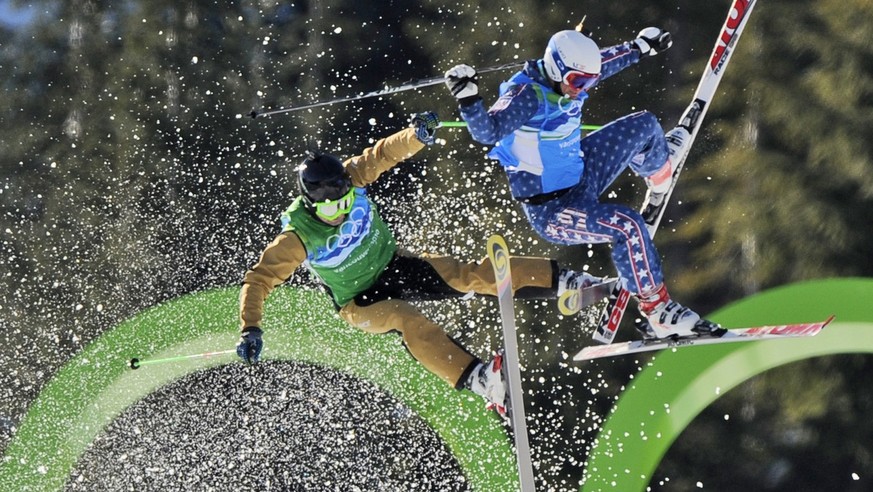 Ted Piccard of France, left and Daron Rahlves of the USA, right crash out during the men&#039;s skicross 8th final at the Vancouver 2010 Olympics in Vancouver, British Columbia, Sunday, Feb. 21, 2010. ...