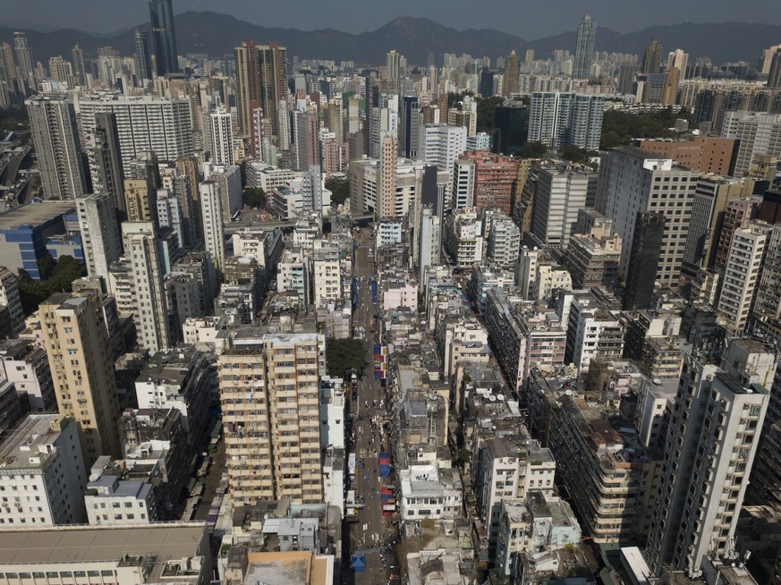 A closed area of Jordan district is seen in Hong Kong, Saturday, Jan. 23, 2021. Thousands of Hong Kong residents were locked down Saturday in an unprecedented move to contain a worsening outbreak in t ...