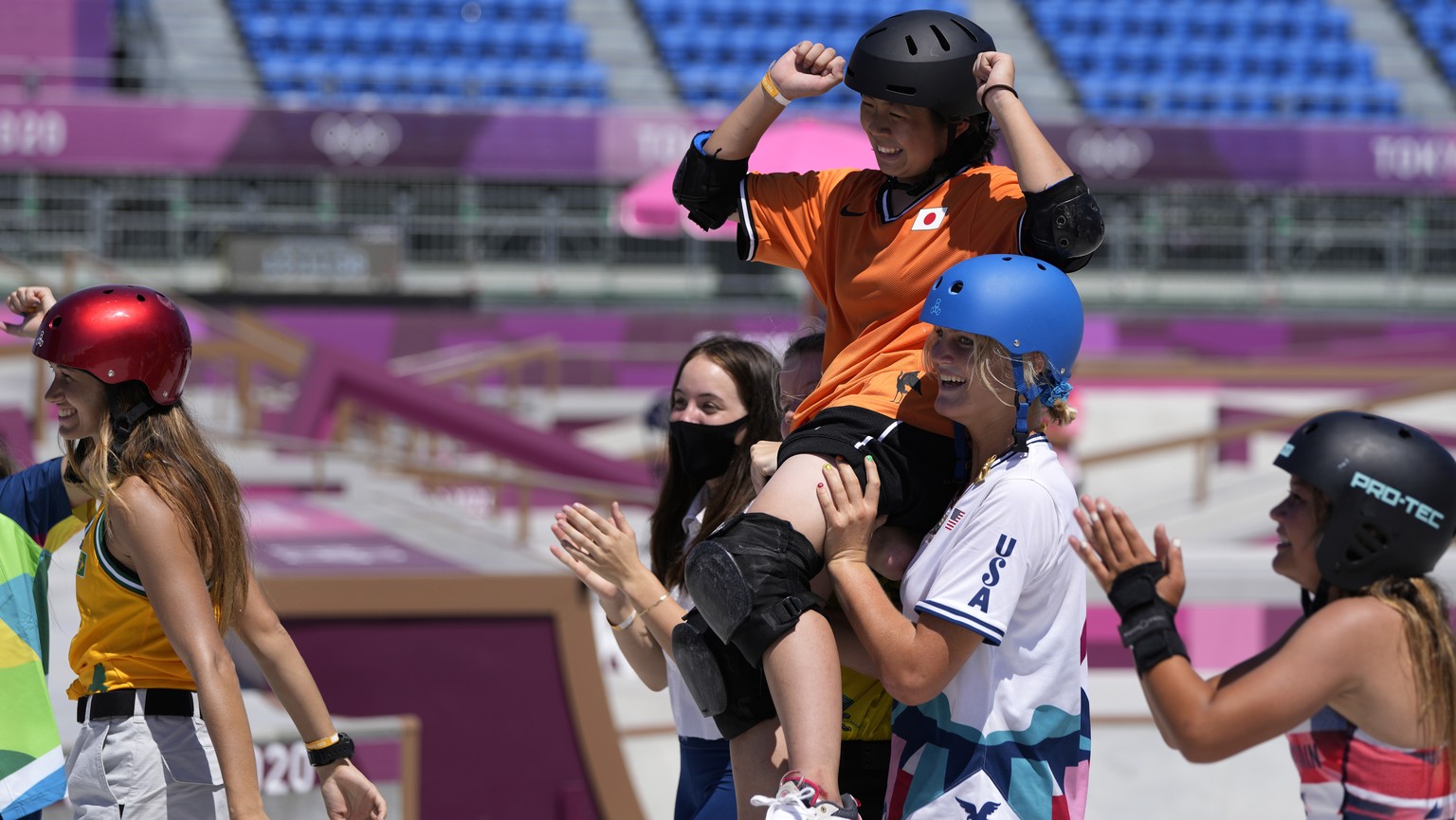 Misugu Okamoto of Japan is carried off after her run in the women&#039;s park skateboarding finals at the 2020 Summer Olympics, Wednesday, Aug. 4, 2021, in Tokyo, Japan. (AP Photo/Ben Curtis)