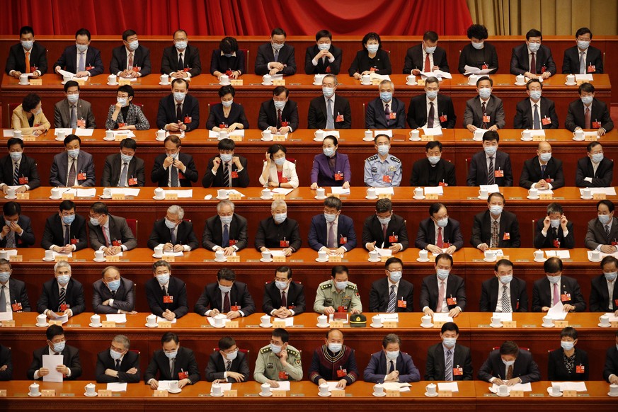 epa08434952 Delegates wearing face masks attend the opening of the third plenary session of the 13th National Committee of the Chinese People&#039;s Political Consultative Conference (CPPCC) in Beijin ...