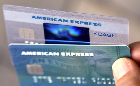 FILE - In this July 18, 2016, file photo, American Express credit cards are displayed in North Andover, Mass. Launched in 1969, the Green Card gave travelers a sense of importance they didnÄôt feel c ...