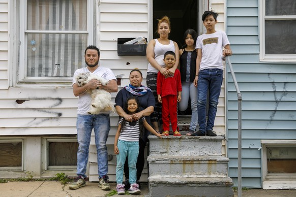 From left, Roberto, holding Henry the family dog, Janeth, and their daughter Allison, 5, pose for a portrait with Janeth&#039;s sister Arely, and her children Roberto, 5, Dora, 11, and Sirus, 14, Tues ...