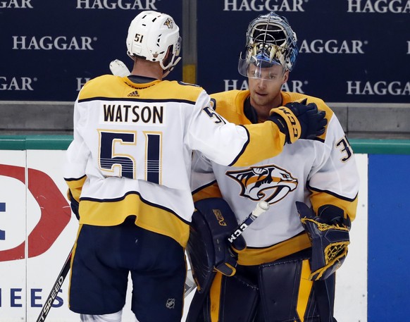 Nashville Predators&#039; Austin Watson (51) taps goaltender Pekka Rinne, right, on the shoulder as they stand by the bench following their 2-1 overtime loss to the Dallas Stars in Game 6 of an NHL ho ...