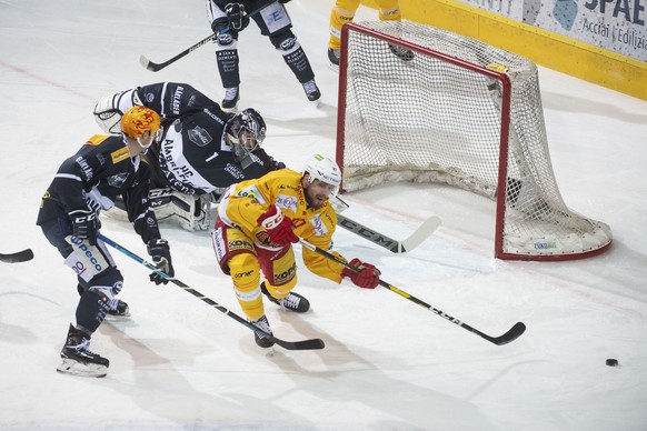 From left, Ambri&#039;s player Dominik Kubalik, Ambri&#039;s goalkeeper Benjamin Conz end Bienne&#039;s player, during the fourth leg of the playoff quarterfinals of the ice hockey National League Swi ...