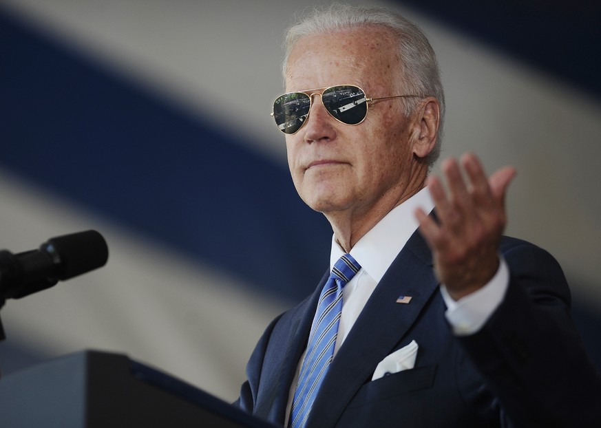 FILE - In this May 17, 2015, file photo, Vice President Joe Biden gestures after donning a pair of sunglasses as he delivers the Class Day Address at Yale University in New Haven, Conn. Graduation sea ...