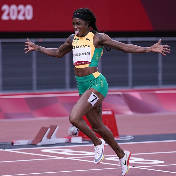 Elaine Thompson-Herah, of Jamaica, wins the women&#039;s 200-meter final at the 2020 Summer Olympics, Tuesday, Aug. 3, 2021, in Tokyo. (AP Photo/David J. Phillip)