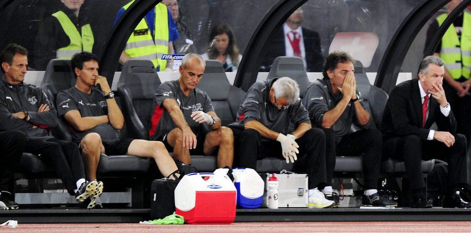 Swiss team officials with head coach Ottmar Hitzfeld, right, show their dejection after the World Cup South Africa 2010 qualifying soccer match between Switzerland and Luxembourg at the Letzigrund Sta ...