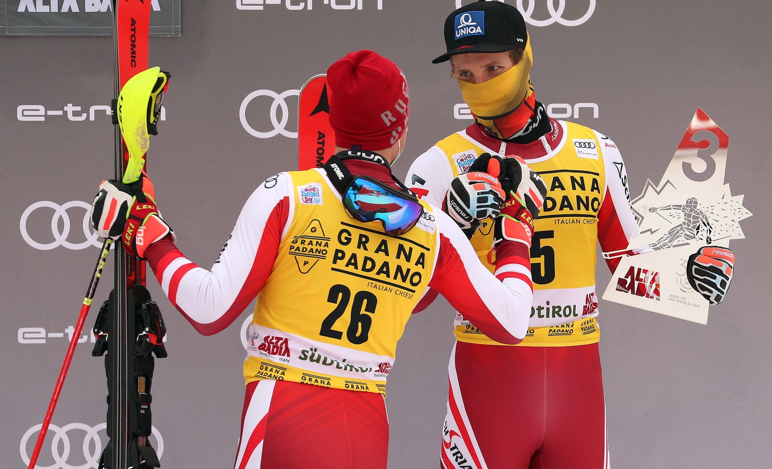 epa08897853 Second placed Manuel Feller (L) of Austria and his teammate, third placed Marco Schwarz celebrate on the podium for the Men&#039;s Slalom race at the FIS Alpine Skiing World Cup in Alta Ba ...