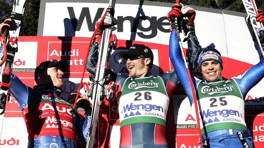 Bode Miller, center, of the United States, winner of the Alpine Ski World cup men&#039;s downhill race, celebrates on the podium with second placed Switzerland&#039;s Didier Cuche, left, and third pla ...