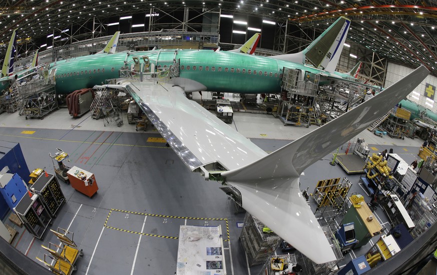 FILE- In this March 27, 2019, file photo taken with a fish-eye lens, a Boeing 737 MAX 8 airplane sits on the assembly line during a brief media tour in Boeing&#039;s 737 assembly facility in Renton, W ...
