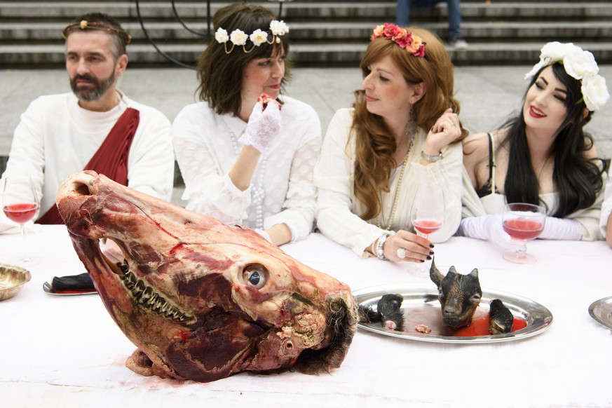 Activists are playing the Holy Last Supper during the happening &quot;The Bloody Meal of the Resurrection&quot;, at a demonstration by the animal liberation movement &quot;269life&quot; to raise aware ...