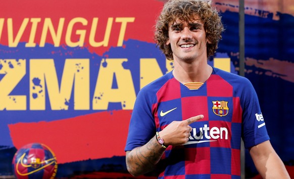 epa07717188 French striker Antoine Griezmann poses for the media during his presentation as a FC Barcelona&#039;s new player held at Camp Nou Stadium in Barcelona, Spain, 14 July 2019. EPA/QUIQUE GARC ...