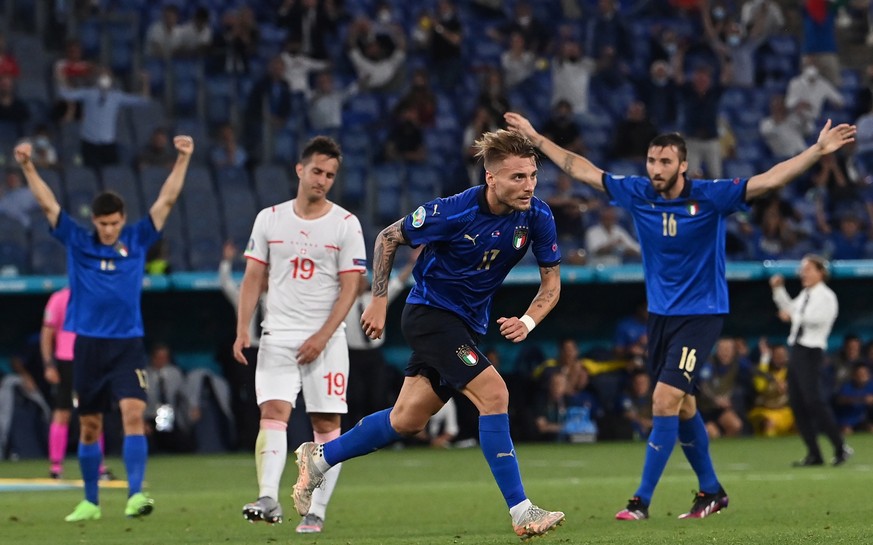 epa09278265 Ciro Immobile (C) of Italy celebrates scoring the 3-0 lead during the UEFA EURO 2020 group A preliminary round soccer match between Italy and Switzerland in Rome, Italy, 16 June 2021. EPA/ ...