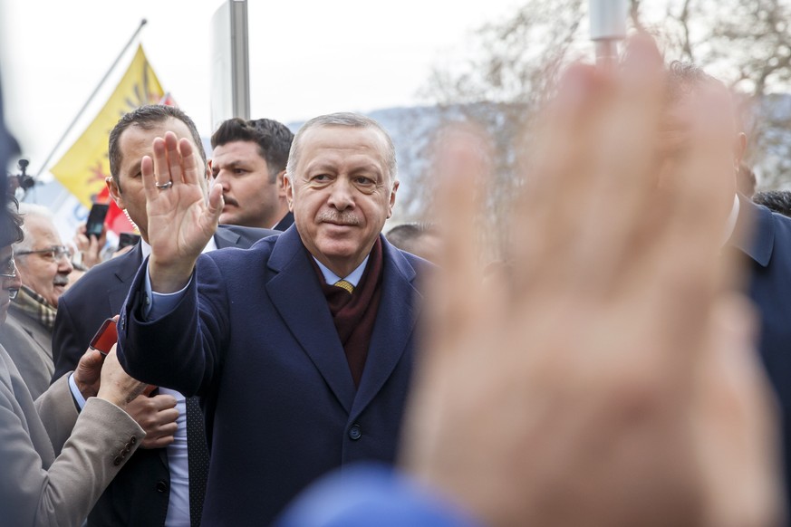 Turkey&#039;s President Recep Tayyip Erdogan greats people when arriving at his hotel one day before the opening UNHCR - Global Refugee Forum in Geneva, Switzerland, Monday, Dec. 16, 2019. (Salvatore  ...
