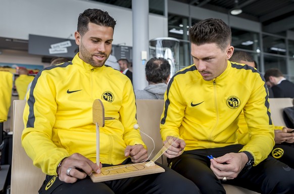 Young Boys&#039; Loris Benito, left, and Christian Fassnacht, at the airport in Bern before the departure to Valencia for the UEFA Champions League group H matchday 4 soccer match between Spain&#039;s ...