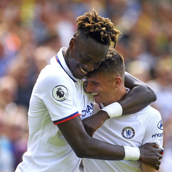 Chelsea&#039;s Mason Mount, right, celebrates scoring his side&#039;s second goal of the game with Tammy Abraham during the English Premier League soccer match between Norwich City and Chelsea at the  ...